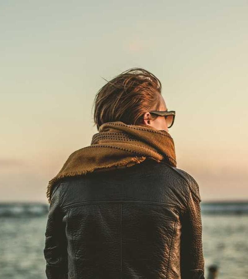Professional photographer with camera in studio setting