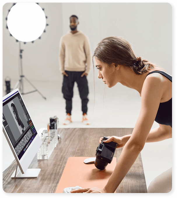 Videographer editing footage on a calibrated workstation