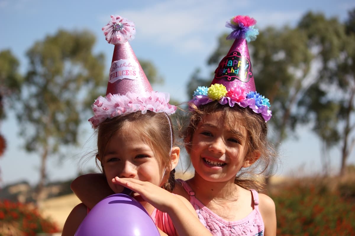 Guests celebrating together at a party with confetti and lights