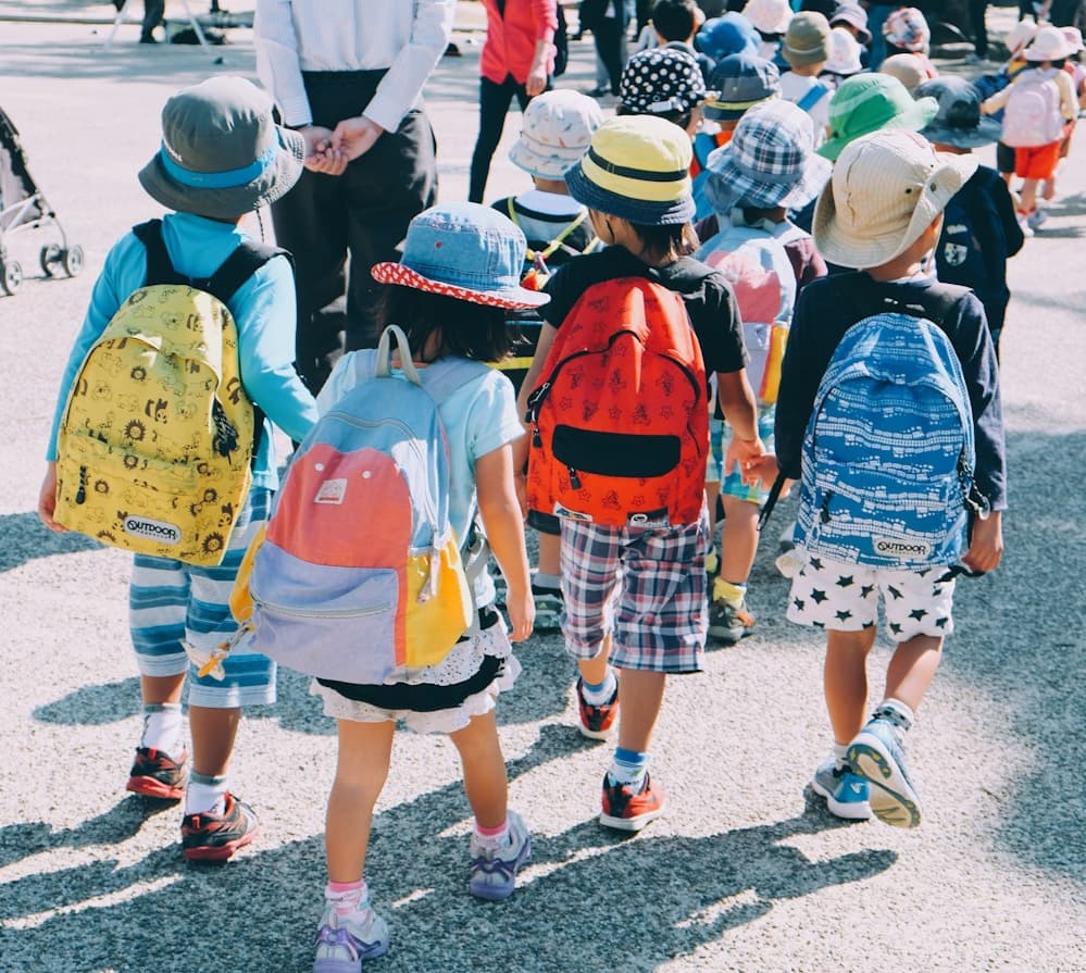 Students gathered outdoors at school during an event