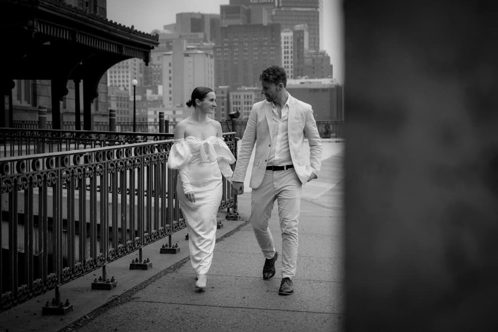 Couple walking through a garden after the ceremony